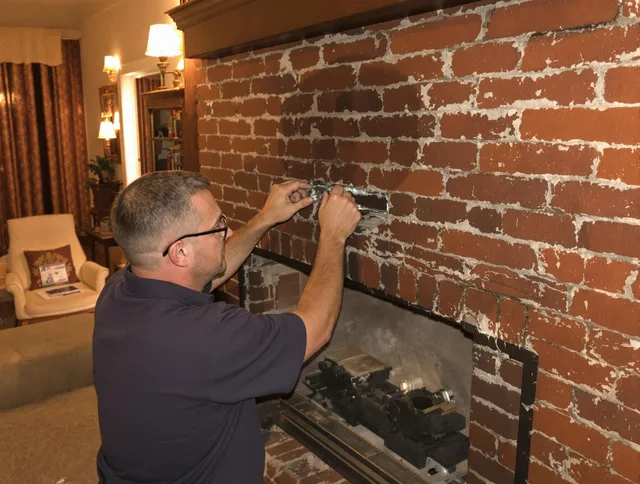 Brook Park Chimney Sweep expert fixing a fireplace in Brook Park, OH